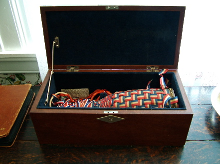 Casket holding the champagne bottle that christened the USS Shields