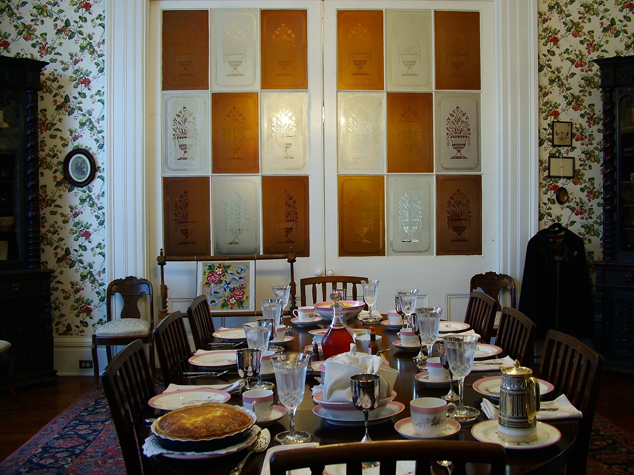 Breakfast table set with antique china in the Stone House Dining Room